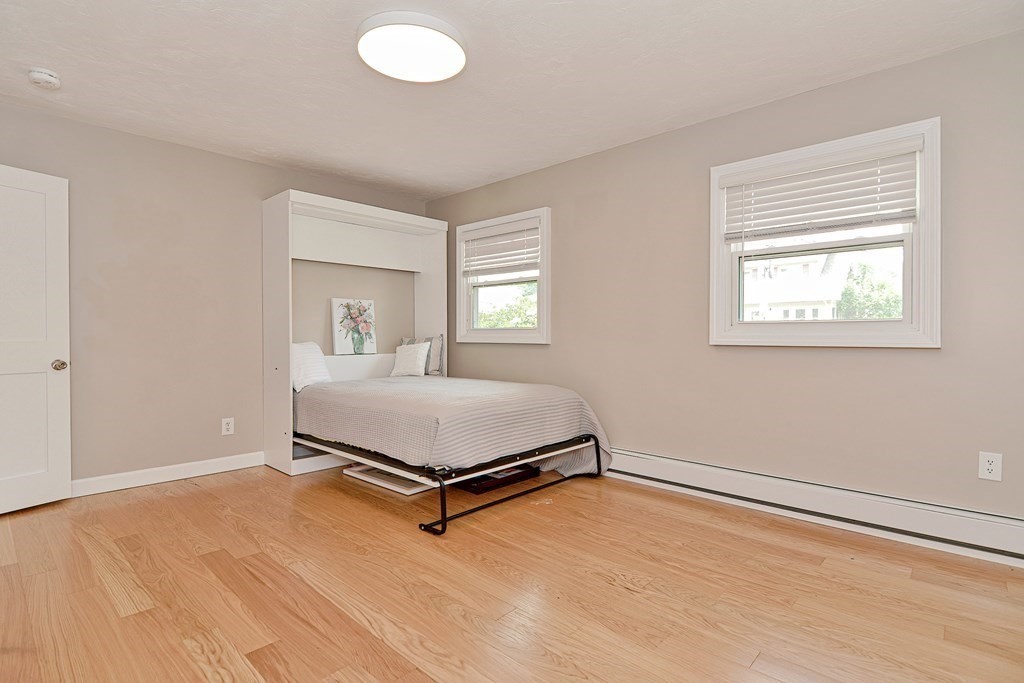 211 Beacon Street Framingham, MA 01701 - Photo 26 of 42 a bedroom with a bed and window