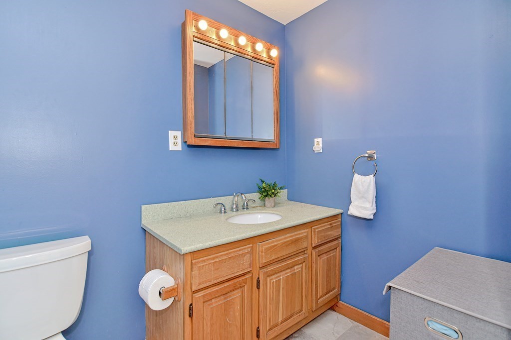 211 Beacon Street Framingham, MA 01701 - Photo 27 of 42 a bathroom with a sink vanity and a toilet