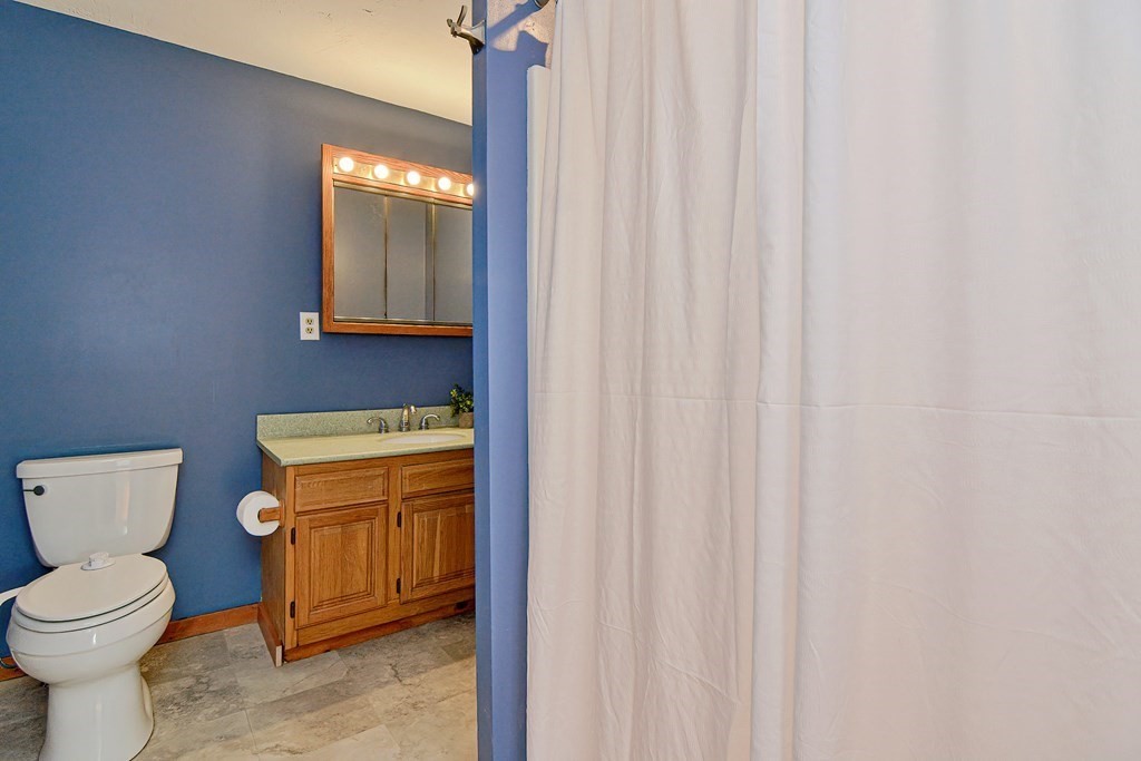211 Beacon Street Framingham, MA 01701 - Photo 28 of 42 a bathroom with a toilet a sink and a window