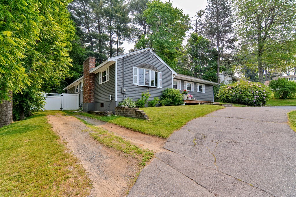 211 Beacon Street Framingham, MA 01701 - Photo 4 of 42 a front view of house with yard and green space