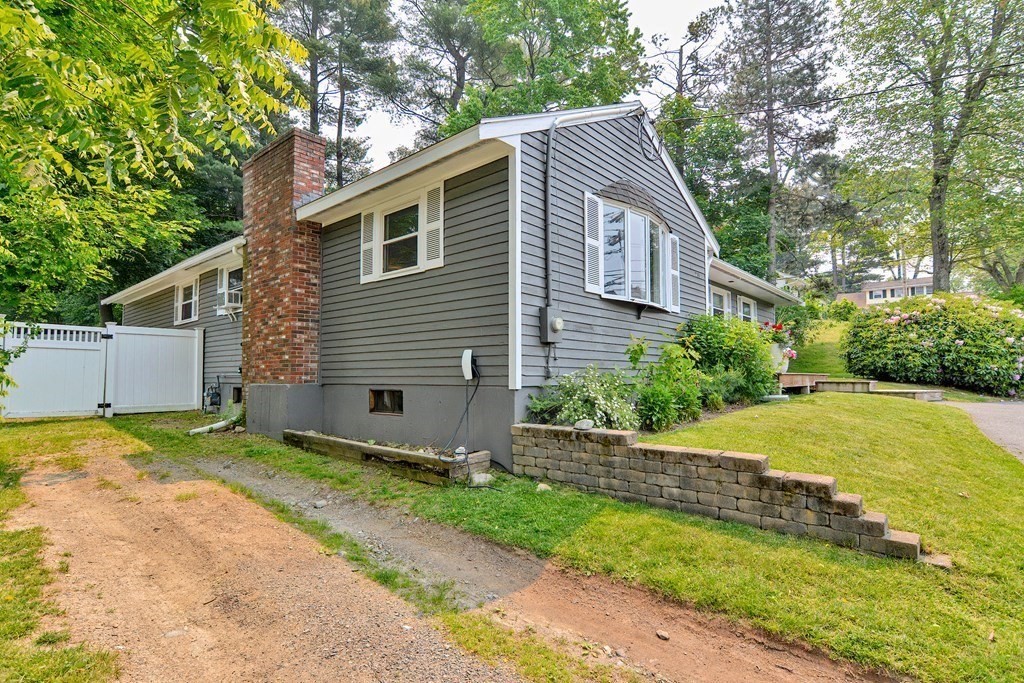 211 Beacon Street Framingham, MA 01701 - Photo 42 of 42 a front view of a house with yard and green space