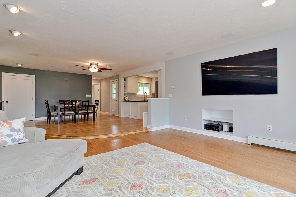 211 Beacon Street Framingham, MA 01701 - Photo 7 of 42 a living room with furniture and a flat screen tv