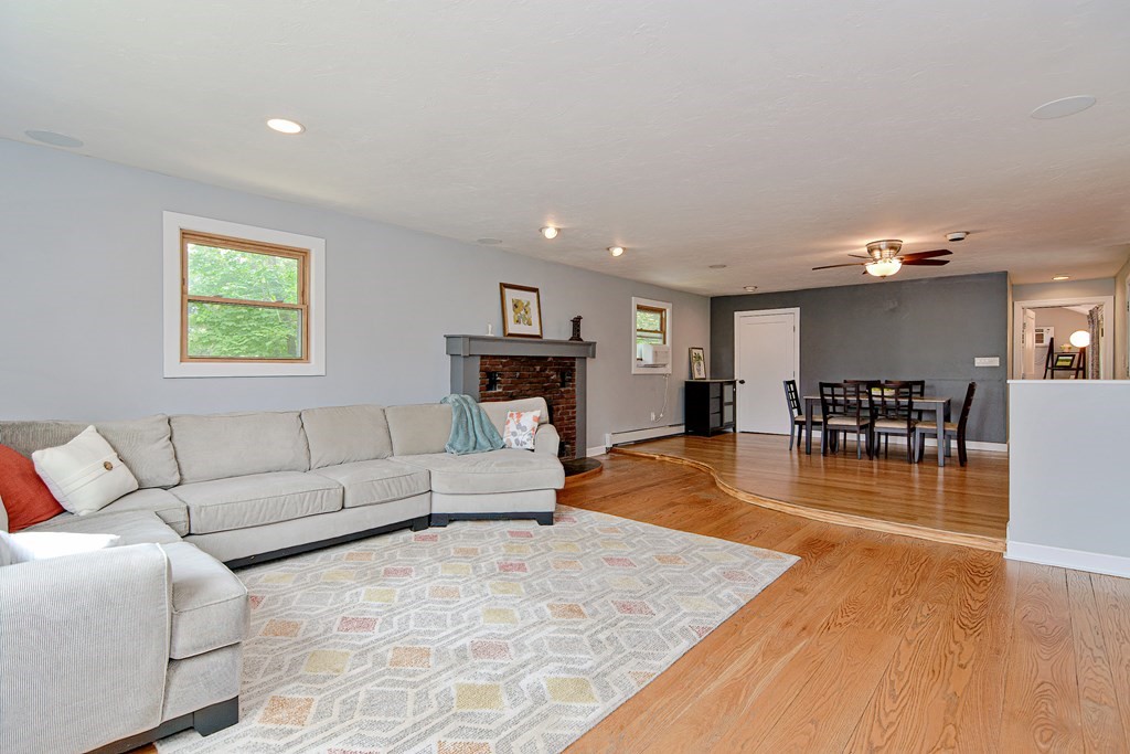 211 Beacon Street Framingham, MA 01701 - Photo 8 of 42 a living room with furniture and a wooden floor
