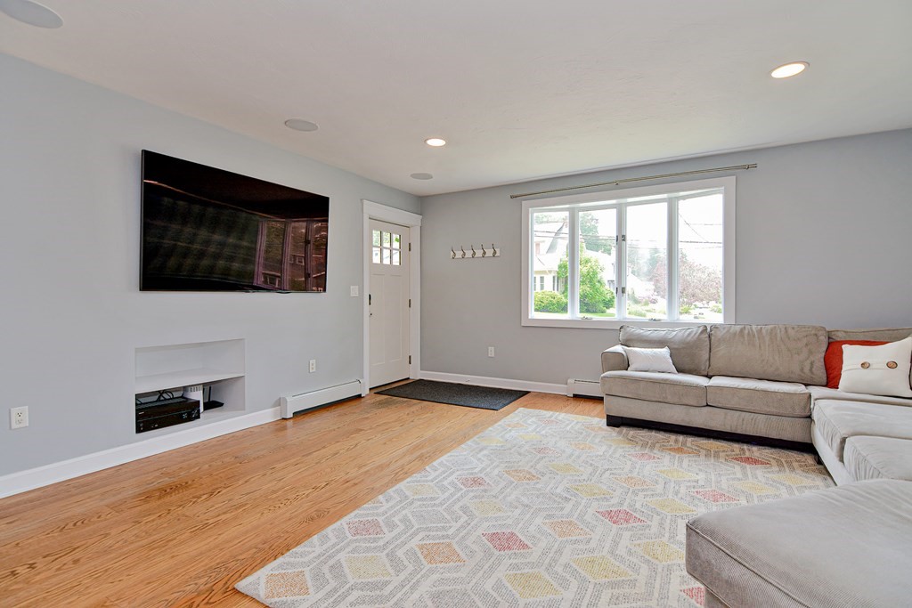 211 Beacon Street Framingham, MA 01701 - Photo 9 of 42 a living room with furniture and a flat screen tv