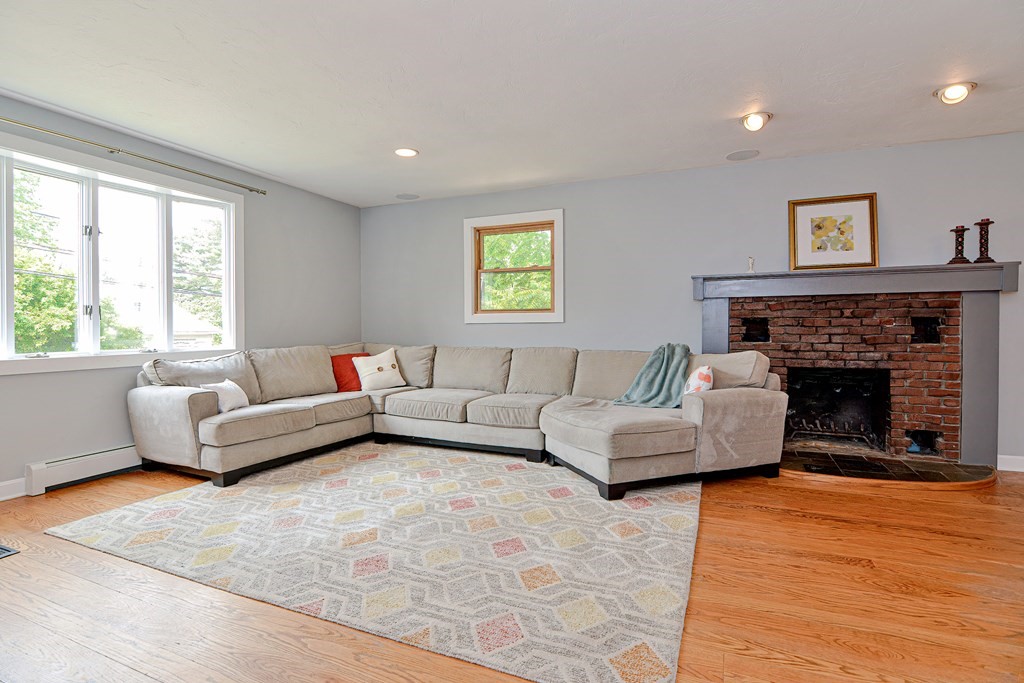 211 Beacon Street Framingham, MA 01701 - Photo 10 of 42 a living room with furniture and a fireplace