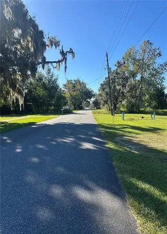 a view of a golf course with a lake