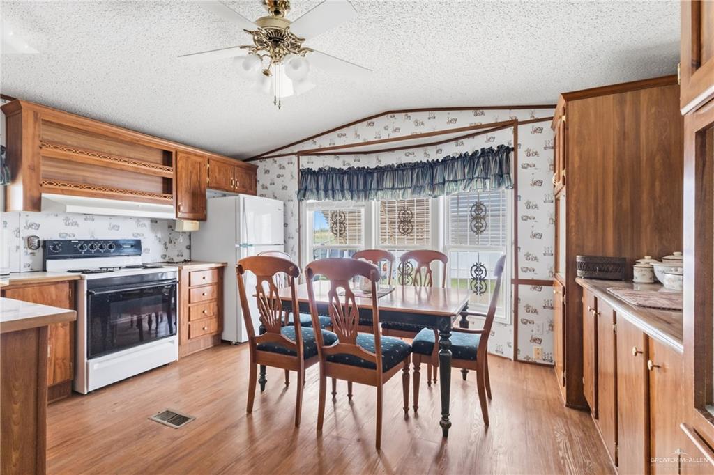 215 South Valley View Road, Unit 15&16 Donna, TX 78537 - Photo 6 of 13 a dining room with furniture and window