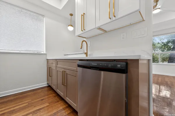 a kitchen with a sink and cabinets