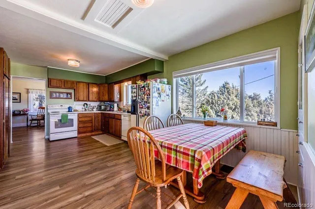 a living room with furniture a couch and a window