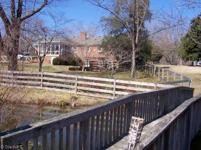 1116 Ritters Lake Road Greensboro, NC 27406 - Photo 5 of 6 Other. Another view of the back from the bridge next to the pond.