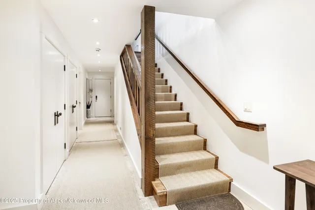 a view of an entryway with wooden floor