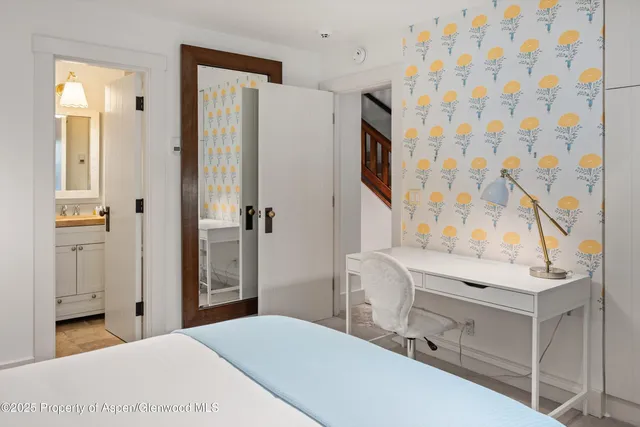 a bathroom with a sink a mirror and a shower