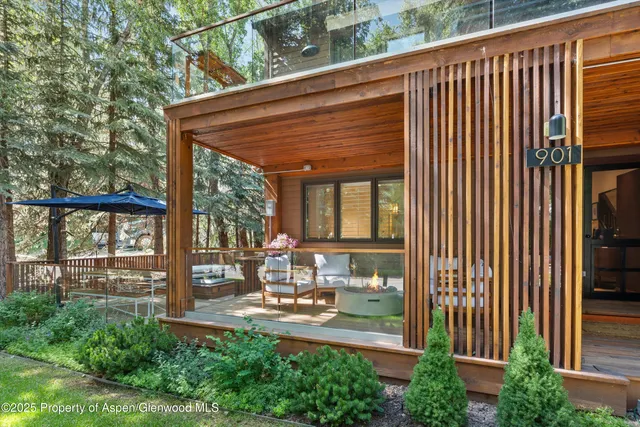 a view of backyard with a garden and outdoor seating