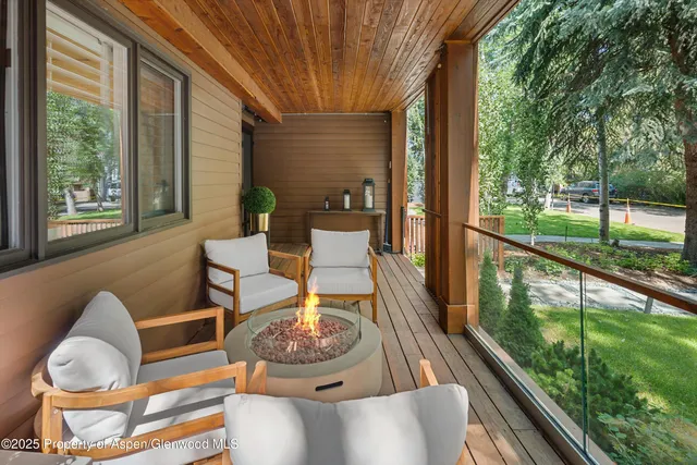 a outdoor dining space with furniture and garden view