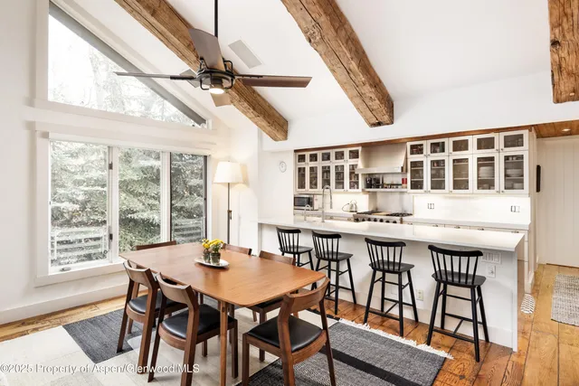 a dining room with a table and chairs
