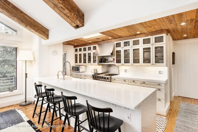 a view of a dining room with furniture and window