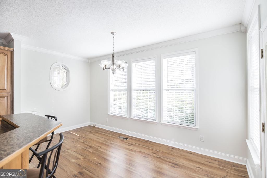 119 William D Street Cochran, GA 31014 - Photo 11 of 42 a view of a room with wooden floor and windows