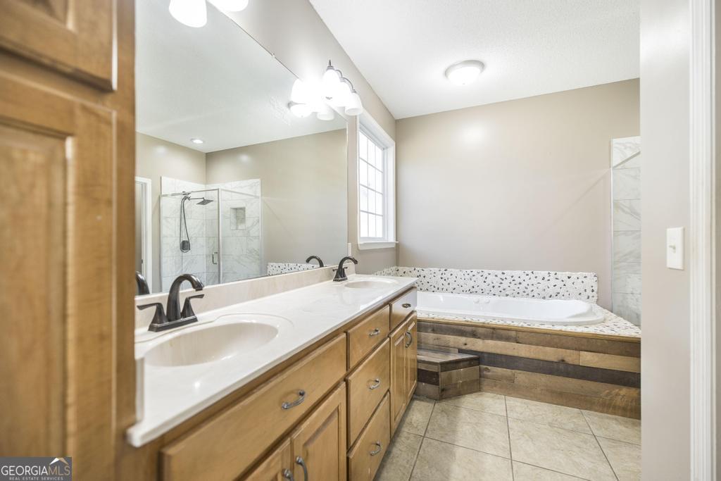 119 William D Street Cochran, GA 31014 - Photo 19 of 42 a bathroom with a sink and a mirror