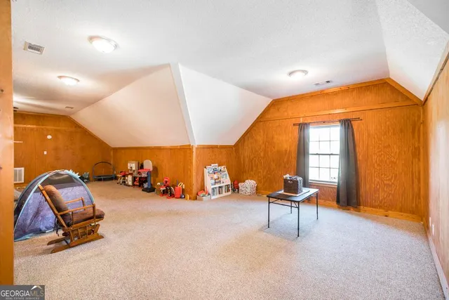 a room with gym equipment and a mirror