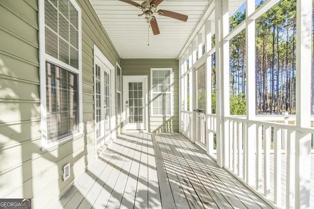 a view of a balcony with wooden floor