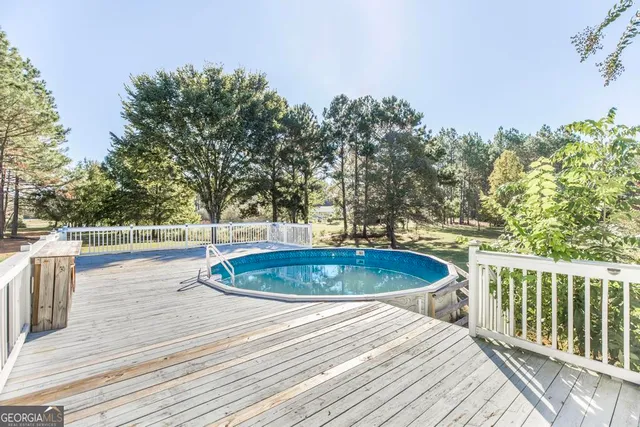 a view of a swimming pool with a patio