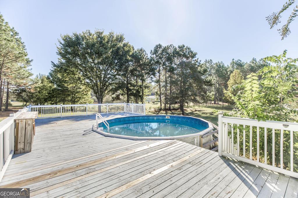 119 William D Street Cochran, GA 31014 - Photo 32 of 42 a view of a swimming pool with a patio