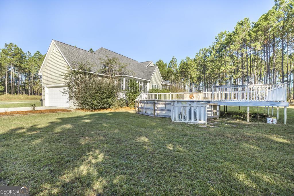 119 William D Street Cochran, GA 31014 - Photo 33 of 42 a view of a house with a yard