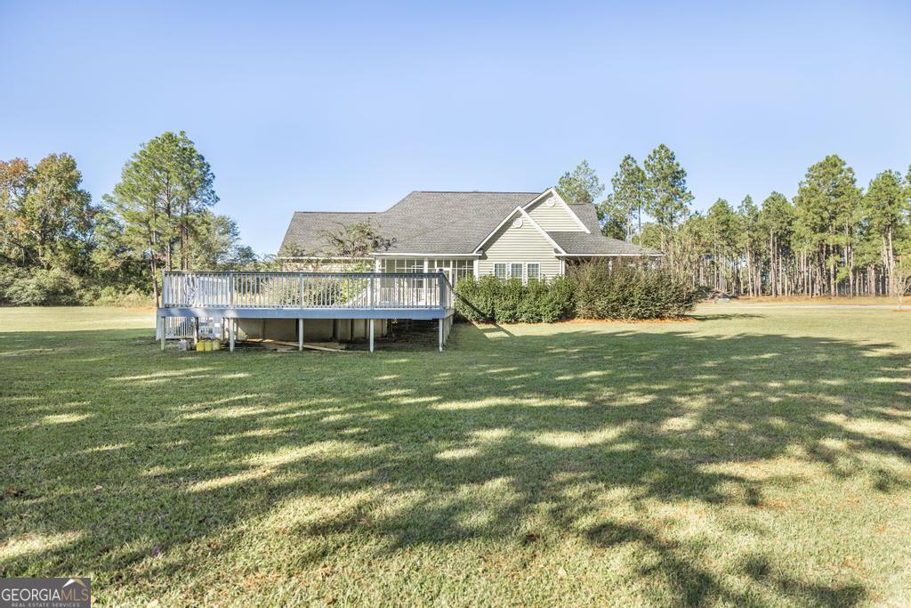 119 William D Street Cochran, GA 31014 - Photo 35 of 42 a front view of a house with a yard table and chairs