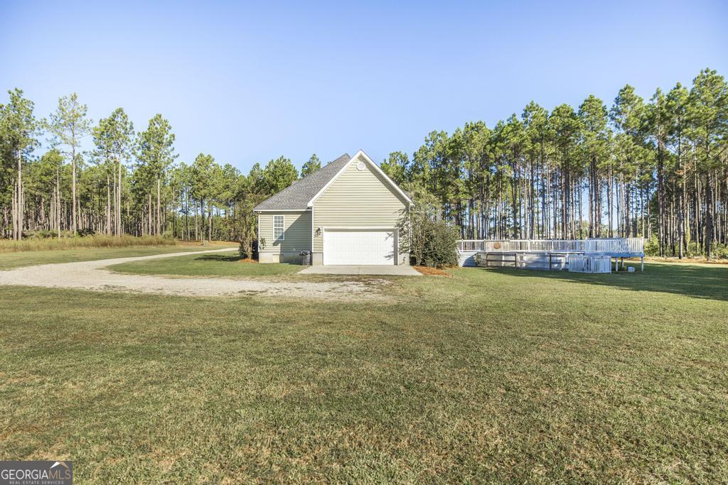 119 William D Street Cochran, GA 31014 - Photo 37 of 42 a house view with swimming pool in front of it