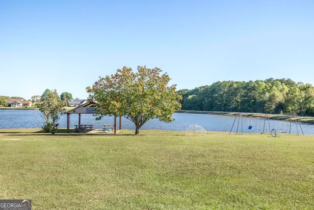 a view of a swimming pool with an outdoor space and seating area