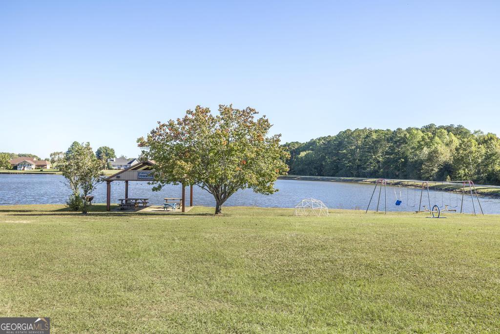 119 William D Street Cochran, GA 31014 - Photo 41 of 42 a view of a swimming pool with an outdoor space and seating area