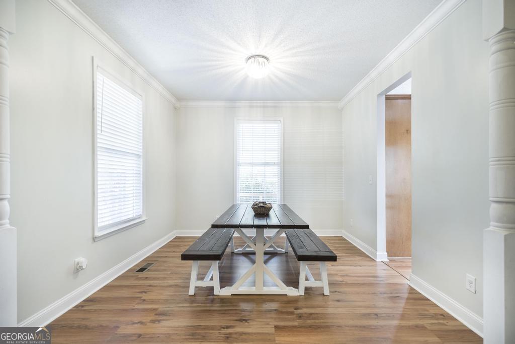 119 William D Street Cochran, GA 31014 - Photo 7 of 42 a floor to ceiling window and wooden floor