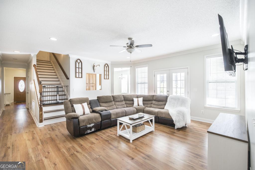 119 William D Street Cochran, GA 31014 - Photo 9 of 42 a living room with furniture and a wooden floor