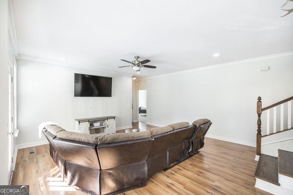 119 William D Street Cochran, GA 31014 - Photo 10 of 42 a living room with furniture and a flat screen tv