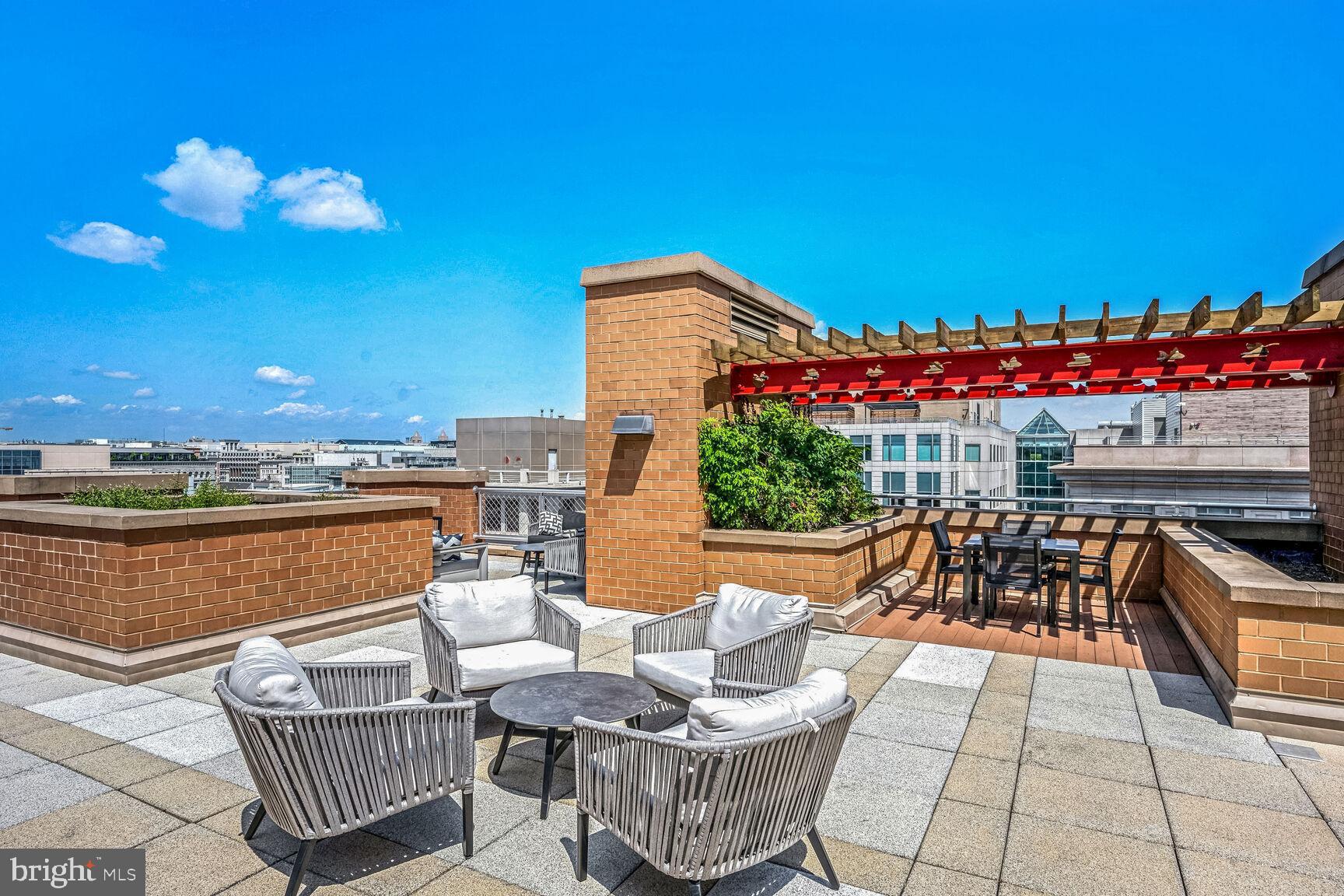 616 E Street Northwest, Unit 1150 Washington, DC 20004 - Photo 40 of 75 a view of a chairs and tables in the patio