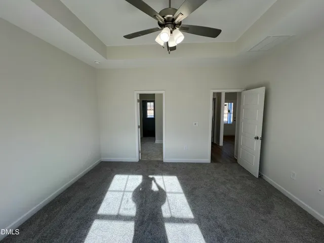 a bathroom with double vanity sink a vanity and a mirror