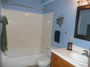 430 Queens Road, Unit 521 Charlotte, NC 28207 - Photo 7 of 7 a bathroom with a sink toilet and shower
