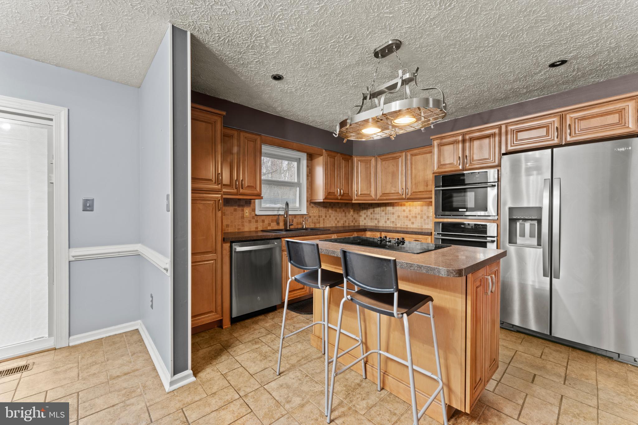3189 Ebbtide Drive Edgewood, MD 21040 - Photo 13 of 33 Modern kitchen with warm wood accents.