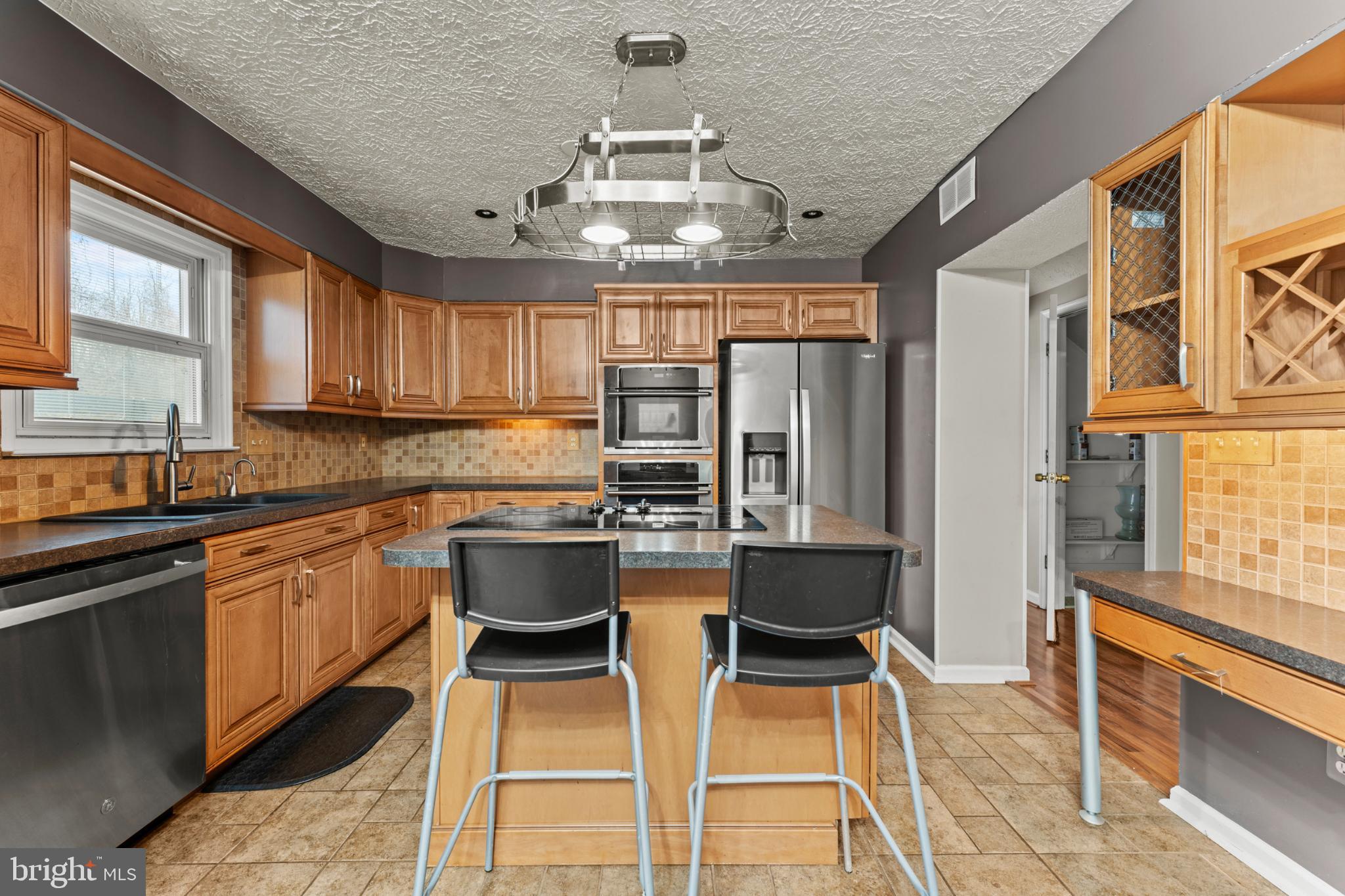 3189 Ebbtide Drive Edgewood, MD 21040 - Photo 14 of 33 Modern kitchen with warm wood accents.