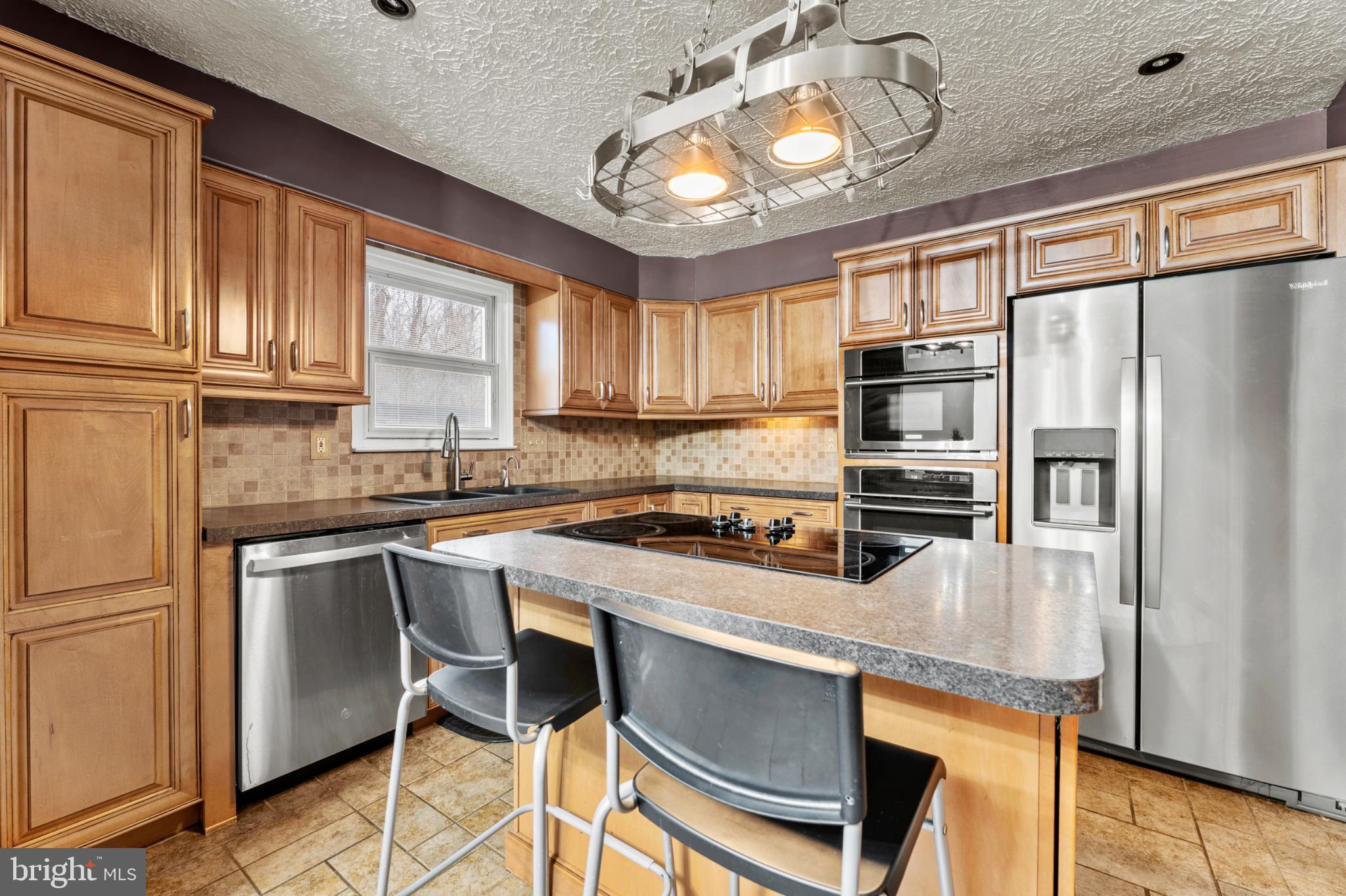 3189 Ebbtide Drive Edgewood, MD 21040 - Photo 8 of 33 Modern kitchen with warm wood accents.