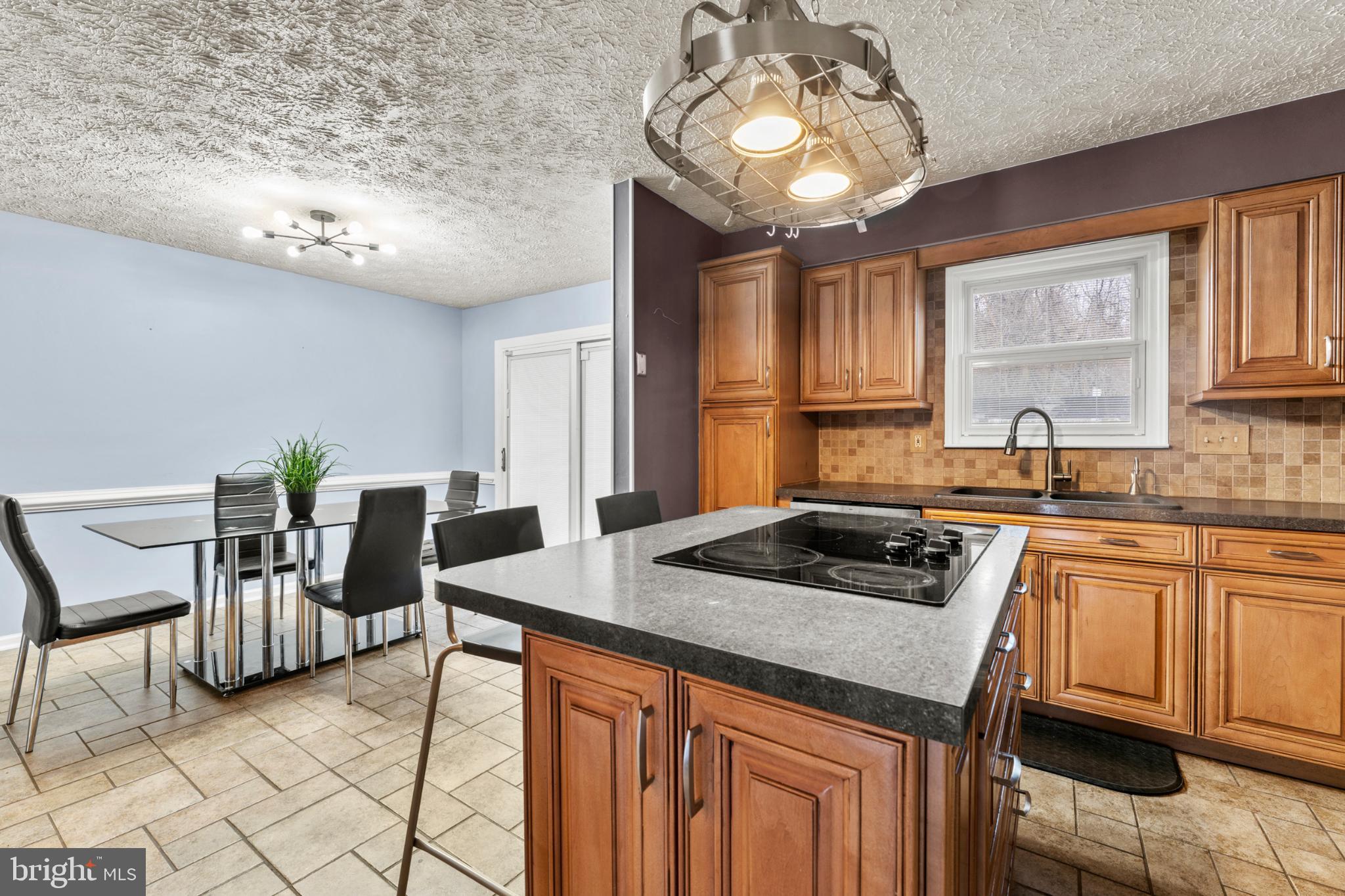 3189 Ebbtide Drive Edgewood, MD 21040 - Photo 9 of 33 Modern kitchen with warm wood accents.