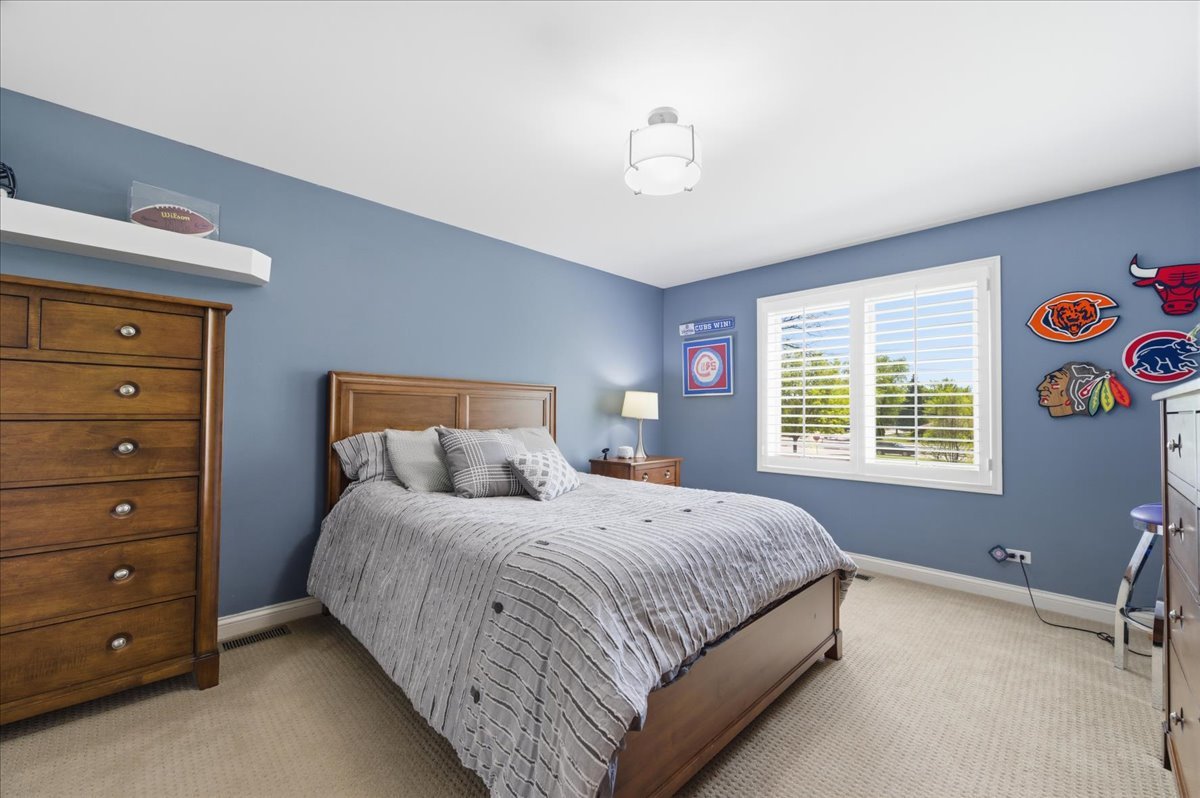 1914 North Ridge Avenue Arlington Heights, IL 60004 - Photo 27 of 50 a bedroom with a bed and a window
