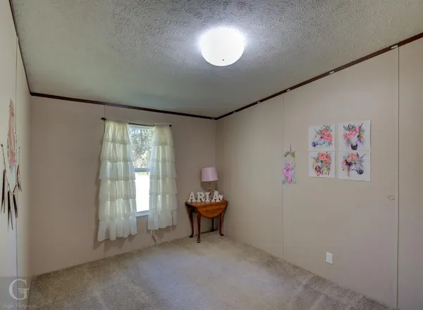 a view of workspace with fan and window