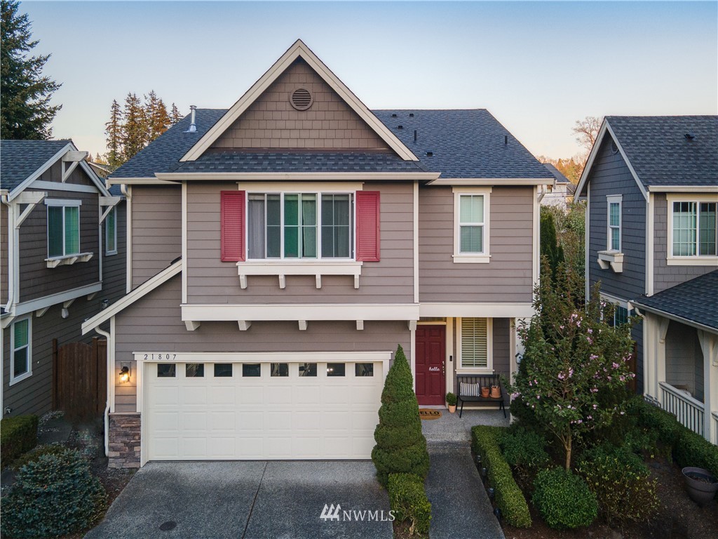 21807 38th Drive Southeast Bothell, WA 98021 - Photo 1 of 30 a front view of a house with a yard