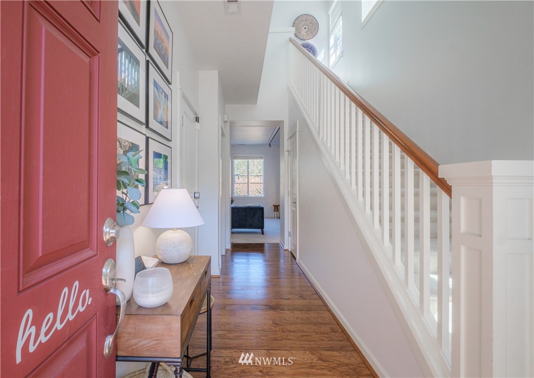 21807 38th Drive Southeast Bothell, WA 98021 - Photo 2 of 30 a view of a hallway with wooden floor and stairs