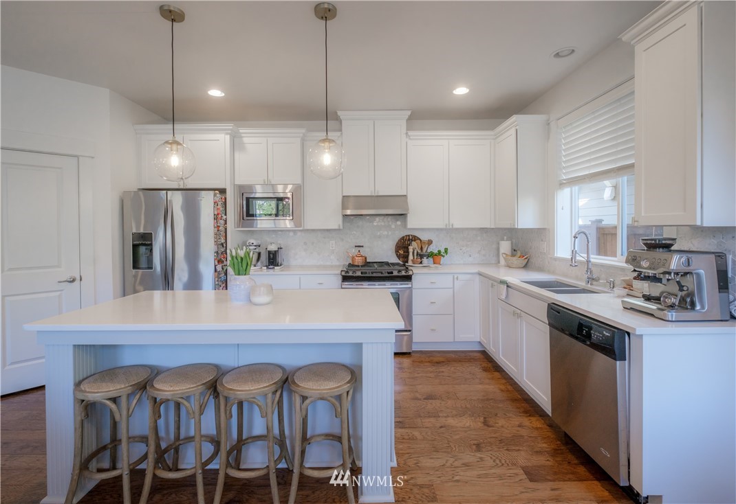 21807 38th Drive Southeast Bothell, WA 98021 - Photo 11 of 30 a kitchen with cabinets a sink and appliances