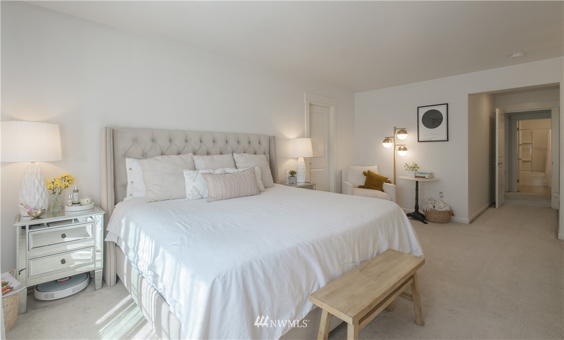 21807 38th Drive Southeast Bothell, WA 98021 - Photo 16 of 30 a bedroom with a bed and a chair