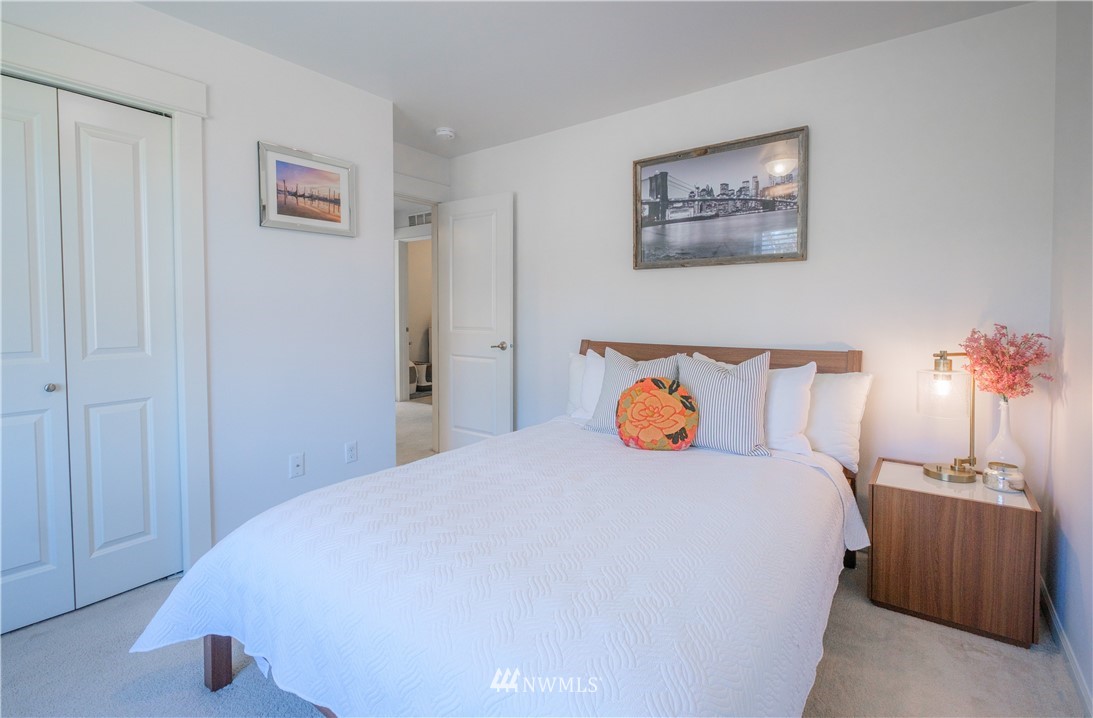 21807 38th Drive Southeast Bothell, WA 98021 - Photo 22 of 30 a bedroom with a bed and a night stand