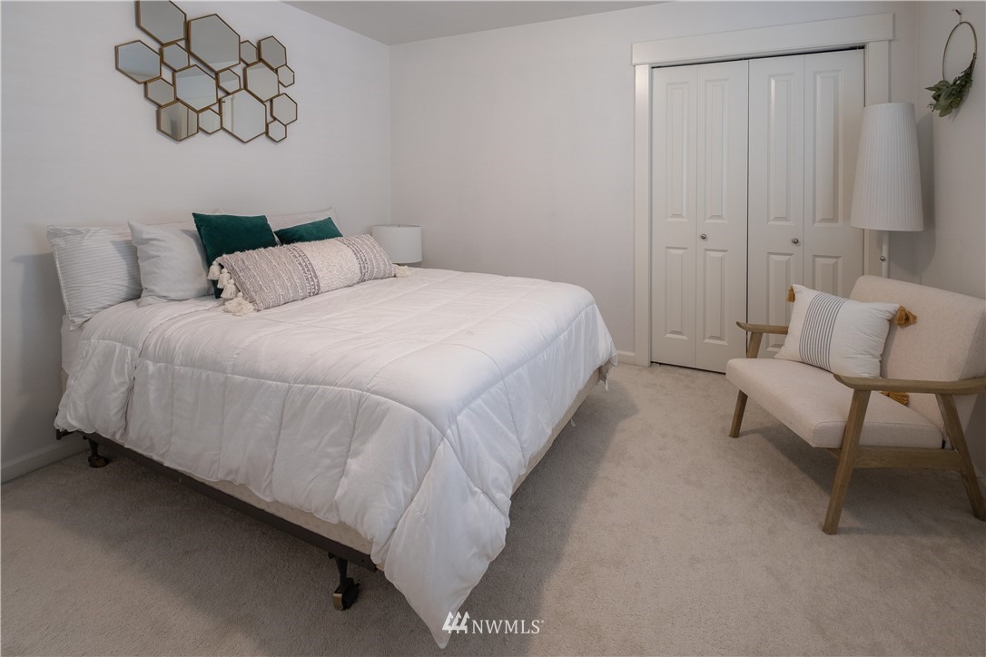21807 38th Drive Southeast Bothell, WA 98021 - Photo 23 of 30 a bedroom with a bed and a chair