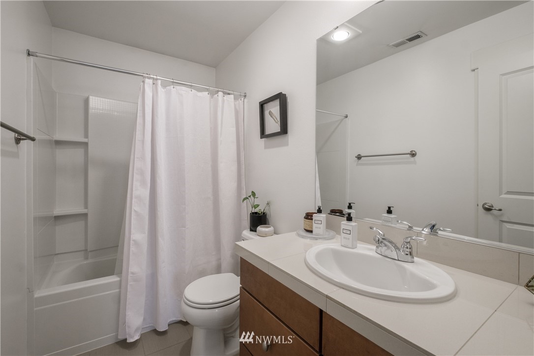 21807 38th Drive Southeast Bothell, WA 98021 - Photo 25 of 30 a bathroom with a sink toilet and shower